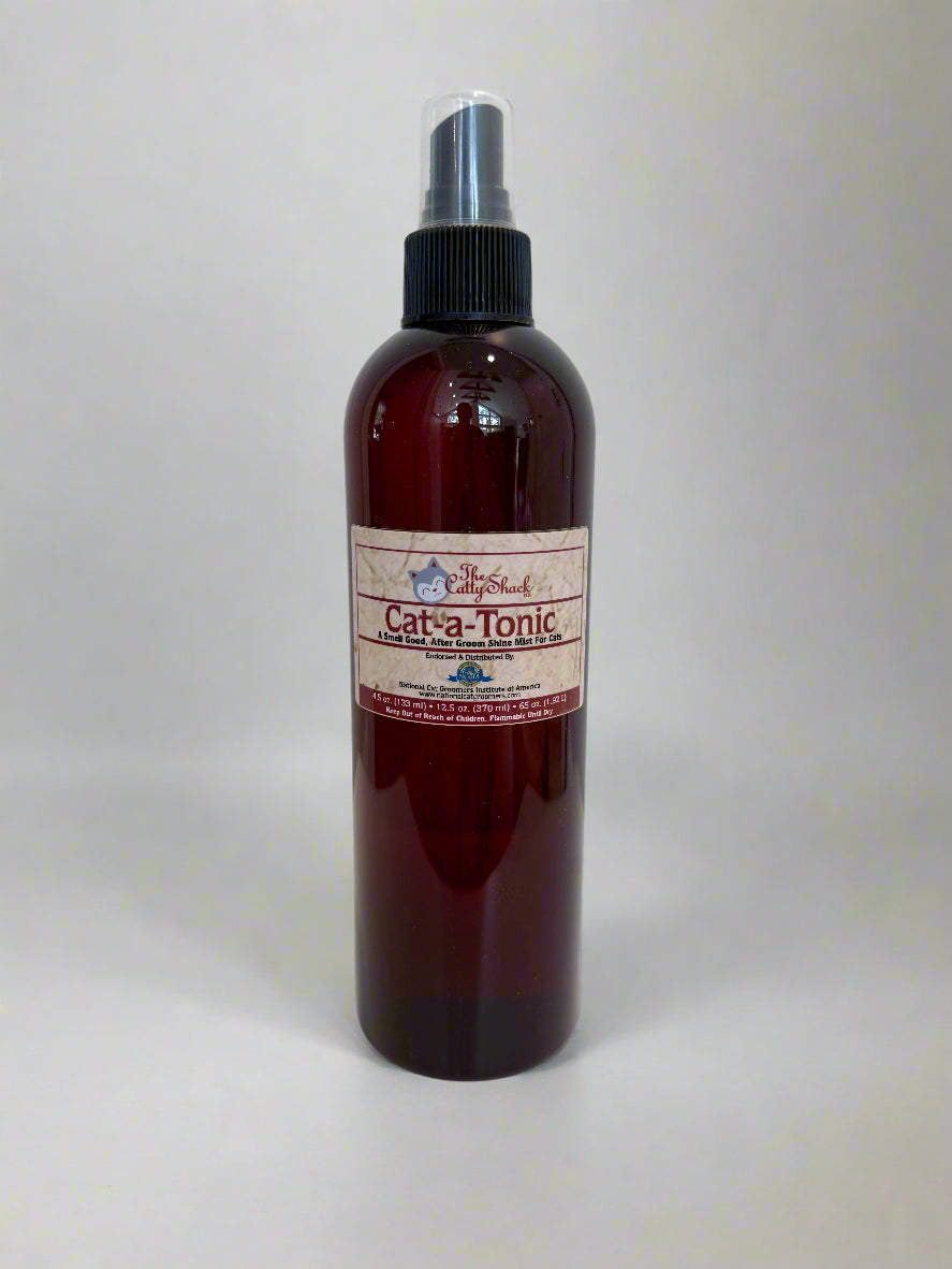 Brown spray bottle labeled 'Cat-a-Tonic' on a white surface with a light gray background