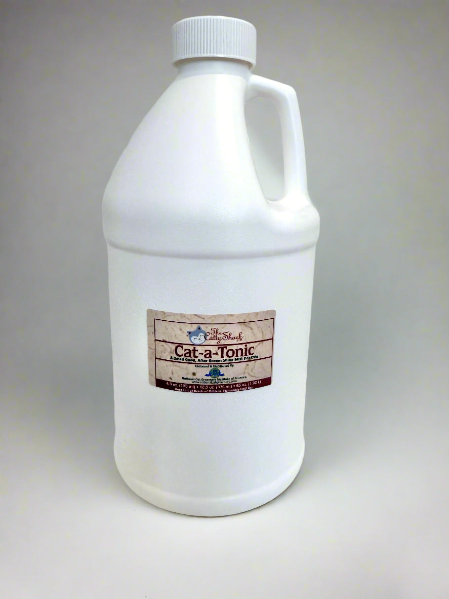 White bottle labeled 'Cat-a-Tonic' on a white surface with a gray background